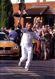 Peter Thompson carrying the Olympic torch